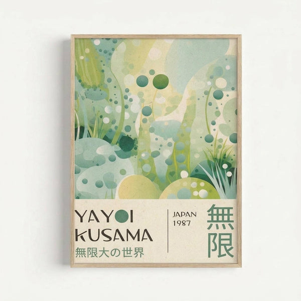 Framed art print featuring abstract underwater scene with floating green, teal and white circles of various sizes scattered across pale green background. Delicate grass-like elements emerge from bottom corners. Bottom section displays black text "YAYOI KUSAMA" with Japanese characters, "JAPAN 1987" and green Japanese text on cream background. Natural wood frame against white wall.
