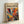 The image is a framed poster with a vibrant abstract painting on the cover.