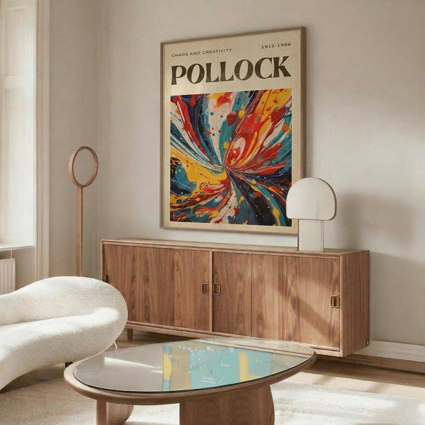 a living room with a large abstract painting hanging on the wall above a wooden cabinet. The painting has a vibrant, colorful design with swirling patterns and shapes. The room also includes a white sofa, a glass coffee table, and a lamp on a side table.