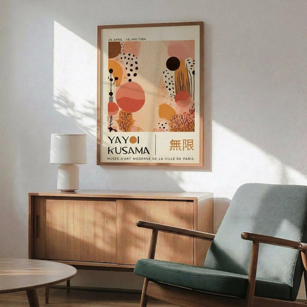 a poster of Yayoi Kusama's "Musee d'Art Moderne de la Ville de Paris" displayed on a wall in a living room setting.