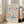 A framed poster of the Métisse art movement, featuring a floral pattern in shades of blue, pink, and orange.