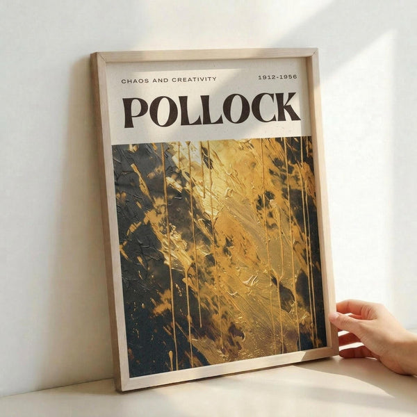 a framed poster with a striking abstract painting in gold and black colors.