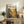 a framed poster of a painting titled "POLOCK" displayed on a wooden cabinet in a living room setting.