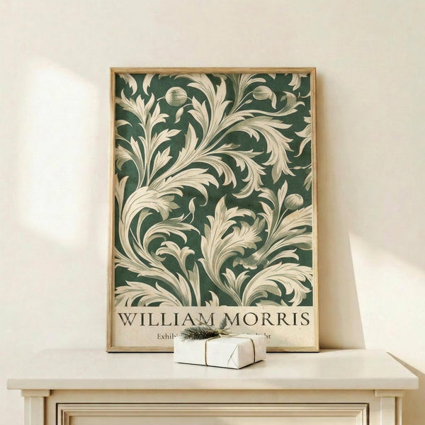 a framed poster of a floral pattern with a white frame, displayed on a white shelf or table.
