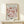 a framed poster of the famous painting "Matsisse" by the artist Henri Matisse, displayed on a white shelf.