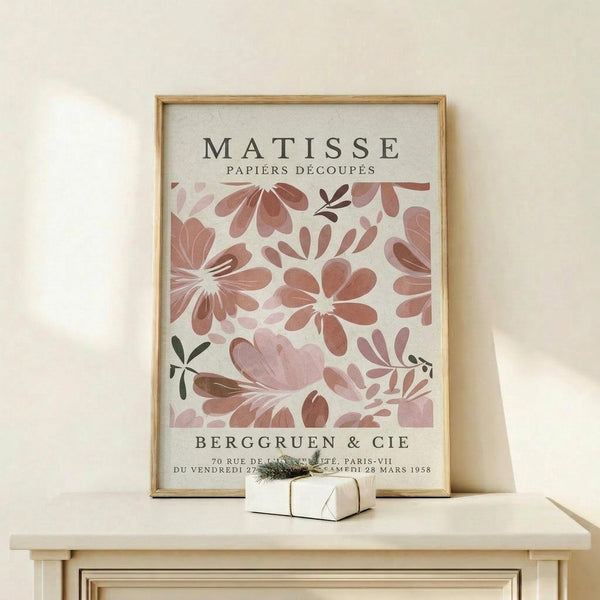 a framed poster of the famous painting "Matsisse" by the artist Henri Matisse, displayed on a white shelf.