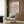 a living room with a white armchair, a floor lamp, and a framed poster of the famous painting "Matsisse" by the artist Henri Matisse.