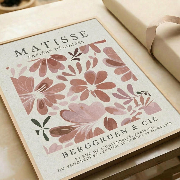 The image is a framed poster featuring a floral design with pink and green flowers, along with text that reads "MATISSE PAPIERS DECOUPS" and "BERGRUEN & CIE".