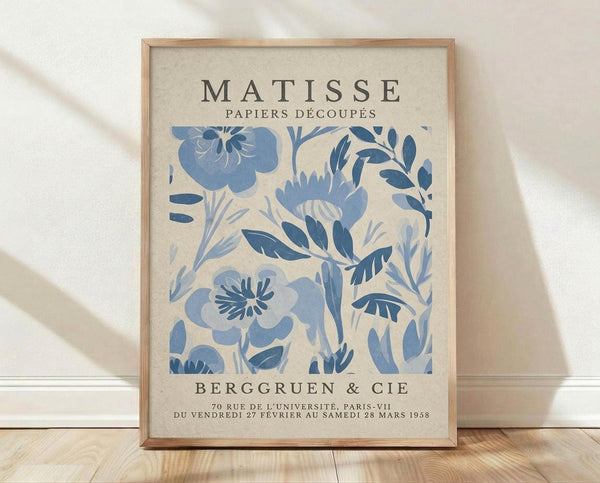 The image is a framed poster featuring the artwork of the famous French artist Henri Matisse. The poster displays a floral pattern in shades of blue and white, and includes text that provides information about the artwork and its location.