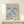 a framed poster of the famous painting "Matsisse" by the artist Henri Matisse, which is displayed on a white shelf.