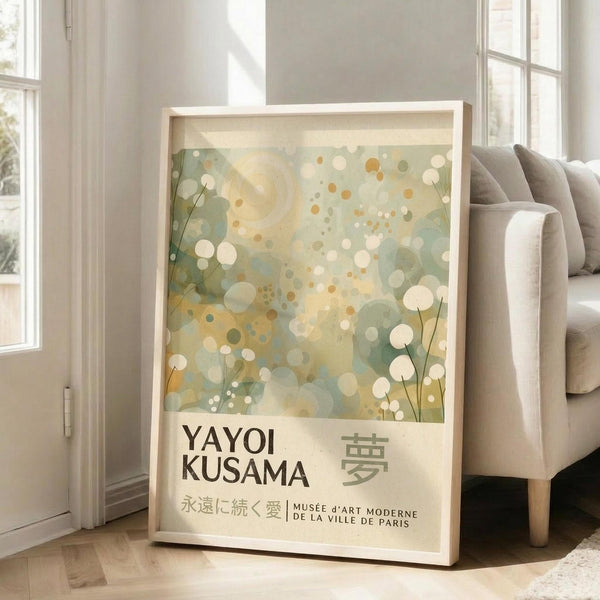 A framed poster of Yayoi Kusama's work displayed on a wooden floor in a living room.