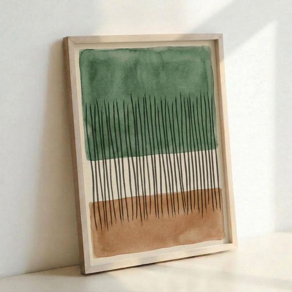 Abstract artwork in light wood frame leaning against white wall. Features watercolor washes in green and terracotta orange with vertical black line work creating forest-like patterns. The piece combines fluid painted backgrounds with precise geometric linework, displayed in natural lighting that creates soft shadows on the wall.