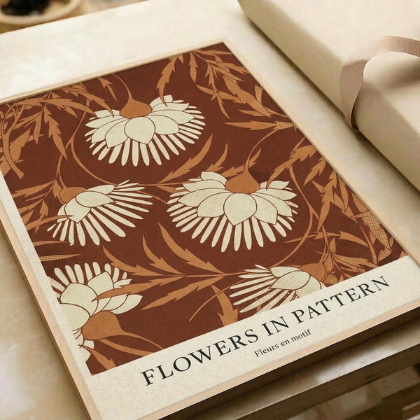 Brown vintage-style poster featuring white daisy-like flowers with radiating petals arranged in a repeating pattern against chocolate brown background with golden botanical leaves and stems. The design has a retro 70s aesthetic with cream text reading "FLOWERS IN PATTERN" and "Fleurs en motif" at bottom. Print is displayed on white paper with rolled paper and neutral ribbon visible in soft lighting.