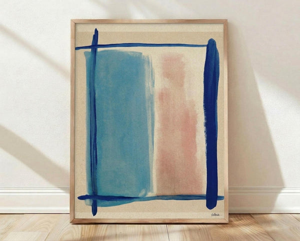 May include: Abstract artwork in light wood frame leaning against white wall on wooden floor. Features soft blue and coral pink rectangular color blocks on cream background, framed by bold navy blue brushstrokes forming a loose border. Modern minimalist composition with organic, painterly texture and muted color palette.