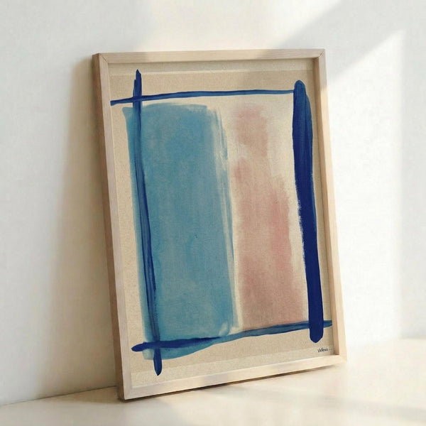 Abstract minimalist artwork in light wood frame leaning against white wall. The composition features soft blue and pink rectangular color blocks on cream background, outlined with bold navy blue brushstrokes forming a geometric frame. The painting has a contemporary, hand-painted appearance with visible texture and organic edges to the color fields.