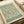 May include: Vintage botanical art print featuring intricate green willow branch pattern on cream background, displayed in an open art book or portfolio with beige ribbon visible. The design shows flowing, intertwining leaves and branches in muted sage green tones with decorative text banners at top and bottom against soft natural lighting.