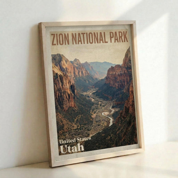 May include: Framed vintage-style travel poster featuring a dramatic canyon landscape with towering red rock cliffs, winding river, and desert vegetation. The artwork shows warm earth tones with text identifying the Utah national park location. Light wood frame displayed against white wall, leaning on surface with natural lighting creating subtle shadows.