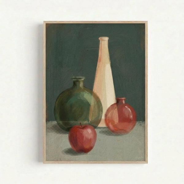 A framed still life painting featuring three glass vessels and a red apple arranged on a light surface against a dark green background. The composition includes a large green rounded bottle on the left, a tall cream-colored conical vase in the center, and a small red spherical bottle on the right, with a glossy red apple positioned in front. The artwork is displayed in a simple light wood frame against a white wall, showing realistic lighting and shadows that give the objects dimension and depth