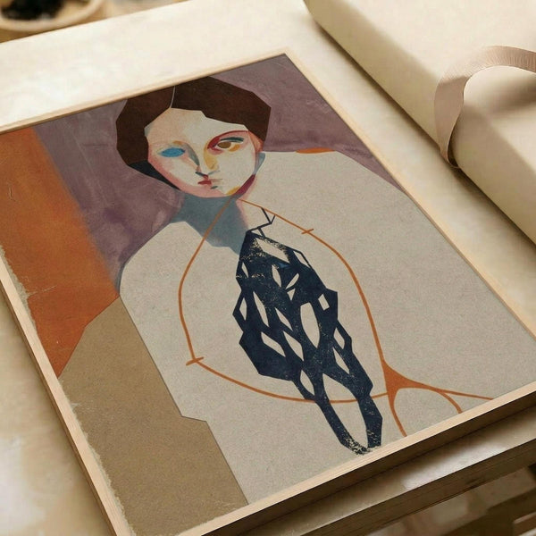 Abstract modernist portrait of a figure with short dark hair and stylized facial features in muted tones. The subject wears dark patterned clothing and sits in an orange-outlined chair against a purple background with geometric orange and beige shapes. The artwork appears as a print on paper within an open book or portfolio, photographed on a light wooden surface with white fabric visible in the background.