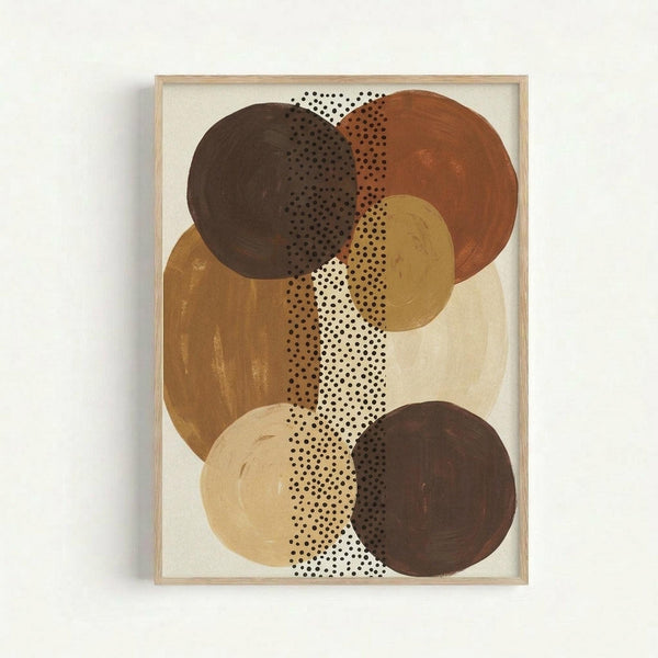 Abstract geometric composition featuring overlapping organic circular shapes in warm earth tones including dark brown, rust orange, golden yellow, and cream colors. A vertical band of small black polka dots on white background runs through the center, intersecting with the painted circles. The artwork has a contemporary minimalist style with visible brushstroke textures on the colored shapes. Displayed in a light wood frame against a white wall.