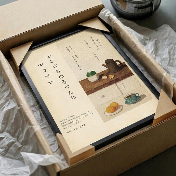 May include: Framed Japanese calligraphy poster with kitchen still life illustration displayed in cardboard shipping box with protective wrapping. Artwork features teapot, dishes, and food items on wooden shelf with Japanese text on cream background. Black frame sits nestled in brown packaging materials with white tissue paper.
