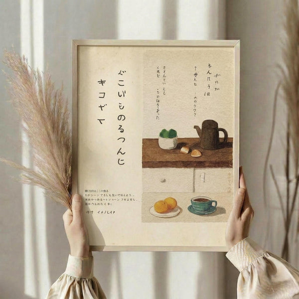 May include: Hands holding a framed poster with Japanese calligraphy and kitchen still life illustrations on cream paper. The artwork shows a wooden table with teapot, plant, cookies, and tea cup in muted earth tones. Person wears beige ruffled sleeves, holds dried wheat stems, standing by white curtained window in soft natural light.