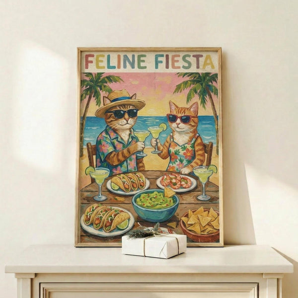 May include: Framed poster print on light wood shelf showing two cats in Hawaiian shirts and sunglasses toasting drinks at beach table with tacos, guacamole, chips and margaritas. Tropical scene with palm trees and ocean backdrop in vintage illustrated style. Small wrapped gift box sits on shelf next to frame against white wall.