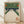 May include: Framed vintage Japanese woodblock print showing bowling alley interior with white pins arranged at lanes, green walls with orange circular lights, and red Japanese characters at bottom. Light wood frame displayed on wooden floor against white wall with natural lighting creating soft shadows.
