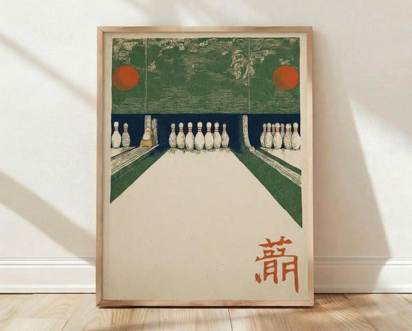 May include: Framed vintage Japanese woodblock print showing bowling alley interior with white pins arranged at lanes, green walls with orange circular lights, and red Japanese characters at bottom. Light wood frame displayed on wooden floor against white wall with natural lighting creating soft shadows.