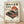 May include: Vintage Japanese-style poster in light wood frame leaning against white wall on wooden floor. Features red turntable with black vinyl record, cherry blossom branches, red sunset with horizontal lines, and bonsai tree silhouette. Japanese text at top, cream background with retro aesthetic. Stereo and Hi-Fi labels visible at bottom corners.