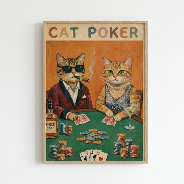 Two anthropomorphic cats sit at a green poker table in vintage illustration style. The male cat wears dark sunglasses, burgundy smoking jacket, and smokes a cigar while holding cards. The female cat wears a pearl necklace and sequined dress, holding a martini glass. Poker chips, fish-shaped tokens, playing cards showing four aces, and a whiskey bottle are scattered across the table. The artwork has a warm orange background and is displayed in a light wood frame against a white wall.