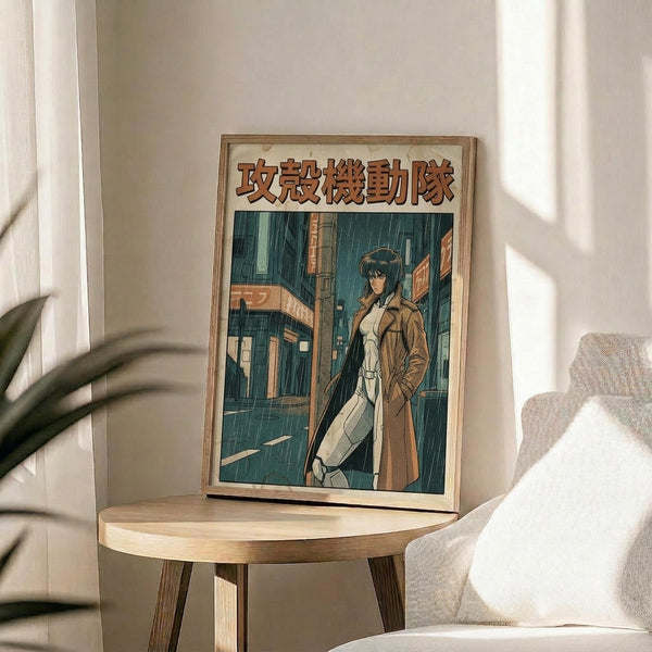 May include: Framed anime poster featuring a dark-haired female character in a beige trench coat standing in a rainy cyberpunk cityscape with teal and orange lighting. The artwork has Japanese text at the top and is displayed in a light wooden frame on a round wooden side table next to a beige upholstered chair, with a potted plant visible in soft natural lighting.