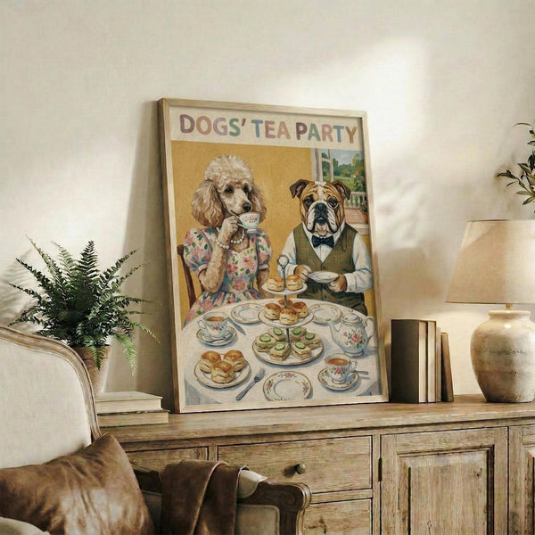 May include: Framed vintage-style poster showing two anthropomorphic dogs having tea - a poodle in floral dress and bulldog in green vest with bow tie, sitting at table with fine china, teacups, scones and sandwiches. Poster displayed on rustic wooden sideboard with books, ceramic vase, and fern plant in cozy living room setting with beige armchair visible.