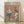 May include: Framed poster print leaning against white wall on light wooden floor. Artwork shows two cartoon ducks doing yoga poses on a mat - one in tree pose wearing blue leggings and headband, another in crossed-legs position. Pink background with colorful brushstrokes, water bottle and bowl nearby, small Buddha statue in corner. Natural wood frame, soft lighting creates shadows on textured white wall.