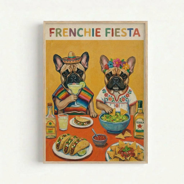 Colorful illustrated poster in wooden frame showing two French bulldogs in Mexican attire sitting at a table with festive food. One dog wears a sombrero and striped serape holding a margarita, the other has a flower crown and embroidered white top. The table displays tacos, guacamole, salsa, tortilla chips, and tequila bottles against a warm yellow and orange background.
