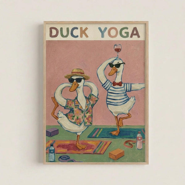 Two white ducks wearing sunglasses practice yoga poses on colorful mats. One duck in a floral Hawaiian shirt and straw hat does tree pose, while the other in a striped shirt balances a wine glass. The whimsical illustration features a pink background with yoga props like blocks and water bottles scattered around. The artwork is displayed in a light wooden frame against a white wall, with "DUCK YOGA" text in colorful letters at the top.