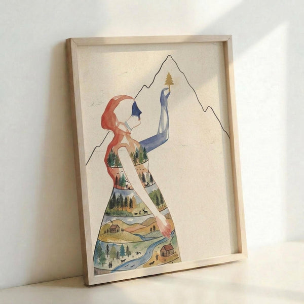 May include: Framed watercolor illustration of woman in yoga pose with red flowing hair and blue clothing, her body filled with detailed nature scenes including forests, mountains, rivers, cabins, and wildlife. Artwork displays soft earth tones and sits in light wood frame against white wall, showing peaceful blend of human form and landscape elements.