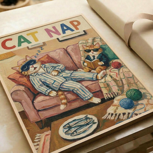 May include: Vintage-style illustrated poster showing two orange cats in a cozy living room scene. One cat wearing striped blue pajamas and sleep mask naps on a brown leather armchair, while another in plaid shirt reads a book nearby. Small fish on a plate sits on wooden floor beside colorful yarn balls and woven rug. Title "CAT NAP" appears in colorful block letters at top. Poster displayed on white surface with rolled paper tube visible.