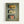 Three vintage Portuguese sardine tin labels displayed in a wooden shadow box frame against olive green fabric backing. The top label shows "Tricana" with a woman's portrait and sardines, the middle shows "Prata Do Mar" with a green sailboat and "Sardinhas com Pimento" text, and the bottom displays "Minor" with a red cat mascot logo. Each tin label features retro typography and colorful illustrations in yellow, cream, green, and red tones.