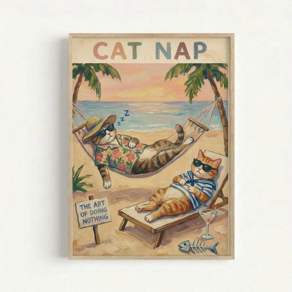Framed vintage-style poster showing two cats relaxing on a tropical beach. One tabby cat wearing sunglasses and a floral Hawaiian shirt sleeps in a hammock between palm trees with "Z Z Z" floating above. An orange tabby in sunglasses and striped shirt lounges on a beach chair beside a cocktail glass and fish skeleton. Sandy beach scene with turquoise ocean, pink sunset sky, and small sign reading "THE ART OF DOING NOTHING." Natural wood frame on white wall.