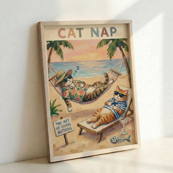 May include: Framed wall art print showing two cartoon cats relaxing on a tropical beach. One tabby cat wearing sunglasses and Hawaiian shirt sleeps in a hammock between palm trees, while an orange cat in striped shirt lounges on a beach chair. Beach scene includes ocean waves, sunset sky, cocktail glass, and small sign reading "The Art of Doing Nothing." Light wood frame against white wall corner.