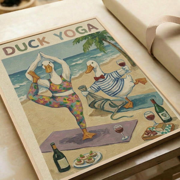 Two white ducks in yoga poses on a beach scene - one in colorful floral leggings doing a standing pose, another in blue striped shirt sitting cross-legged holding wine. Tropical beach background with palm tree, scattered wine bottles, glasses, and appetizers on sand. Vintage-style illustration print on cream paper, displayed on light wooden surface with rolled paper in background.