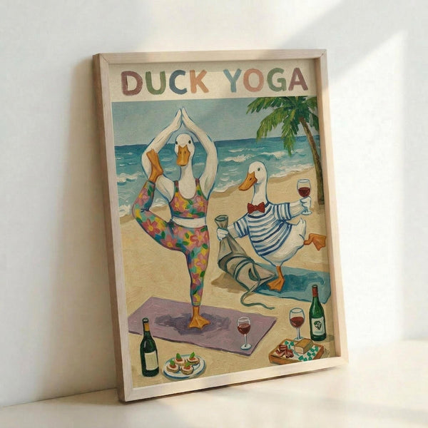 May include: Framed vintage-style poster showing two cartoon ducks doing yoga on a tropical beach. One duck in colorful floral yoga outfit performs tree pose on purple mat, while another duck in blue striped shirt sits with wine glass. Scene includes palm tree, ocean waves, wine bottles, appetizers, and beach picnic setup. Artwork has retro travel poster aesthetic with "DUCK YOGA" text in multicolored letters. Natural wood frame, displayed leaning against white wall.