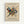 Framed abstract art print featuring Kandinsky's geometric composition with intersecting black lines, colorful triangles, circles, and squares in blue, red, yellow, and green. Exhibition poster format with "KANDINSKY" at top and "TATE BRITAIN EXHIBITION" text below the artwork. Light wood frame against white wall background.