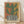 May include: Framed abstract art print leaning against white wall on light wood floor. The artwork shows a stylized green cactus with curved arms in a black and white striped pot, set against warm orange and yellow gradient background. Light wood frame with white mat. Natural lighting creates soft shadows on textured white wall.