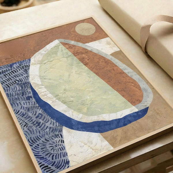 May include: Abstract art print displayed on wooden surface with cream ribbon nearby. Artwork features organic curved shapes in terracotta brown, sage green, and navy blue with white accents. Small circular moon element in upper corner. Textured brushstroke appearance with flowing, contemporary composition combining earth tones and botanical-inspired forms.