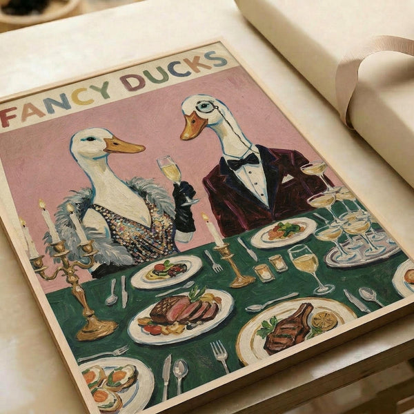 May include: Vintage-style poster print featuring two elegantly dressed ducks at a formal dining table. The female duck wears a sparkly black dress with feathers, while the male sports a burgundy tuxedo with bow tie. They're seated at a green tablecloth-covered table laden with fine dining plates, wine glasses, candles, and gourmet dishes. The illustration has a soft pink background with "FANCY DUCKS" text at the top in colorful letters. The poster is displayed on white wrapping paper with cre