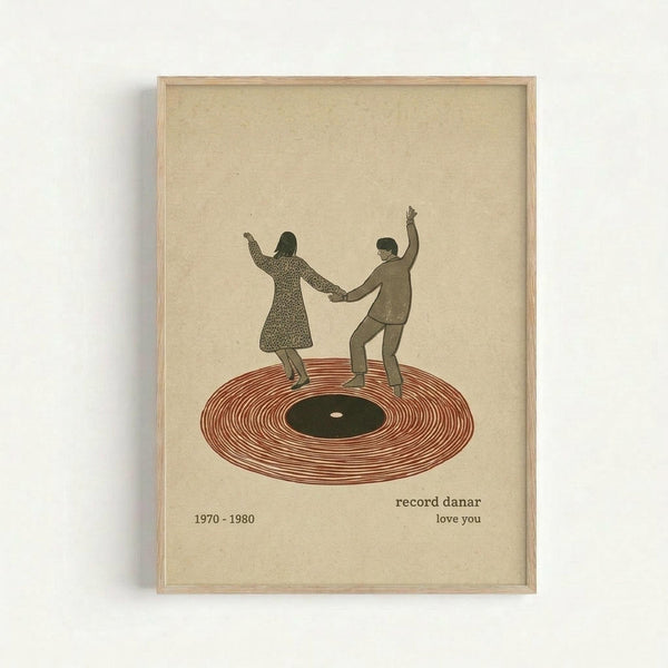 Framed vintage-style poster print featuring two silhouetted figures dancing on a large vinyl record. The woman wears a patterned dress and the man a suit, both with arms raised while holding hands. The record is illustrated in warm rust-red tones with a dark green center label. Text below reads "record danar" and "love you" with "1970-1980" on the left. The artwork has a cream-colored background and is displayed in a thin natural wood frame against a white wall.