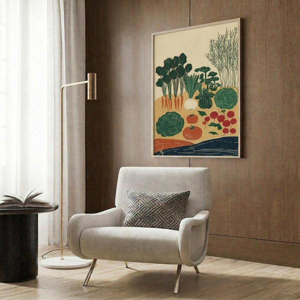 May include: Framed vegetable garden harvest illustration displayed above a beige armchair with geometric pillow in modern living room with wood paneled wall, gold floor lamp, and dark round side table with open book