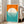 May include: Framed geometric poster leaning against white wall beside beige sofa in bright living room. Orange and teal color blocks with large cream circle containing white horizontal lines, resembling stylized sun over water. Black "bauhaus" text vertically aligned on right side. Light wood frame, approximately 2-3 feet tall, positioned on hardwood floor near large windows with natural lighting.